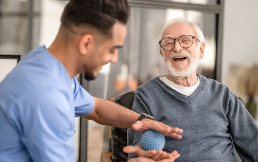 A VCCC doctor is treating an old patient.