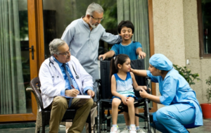 A VCCC doctor and a nurse is comforting a patient and the families