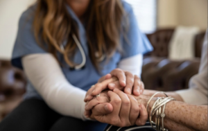 A doctor and a lady are holding hands together.