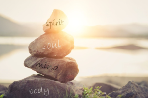 a stack of rocks with words written on them