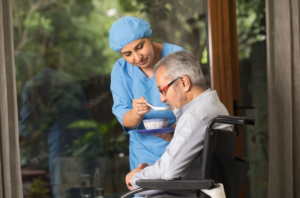 A VCCC nurse is taking care of a cancer patient.